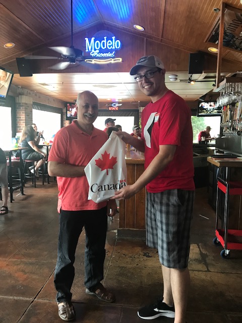 Winner of raffle accepting prize