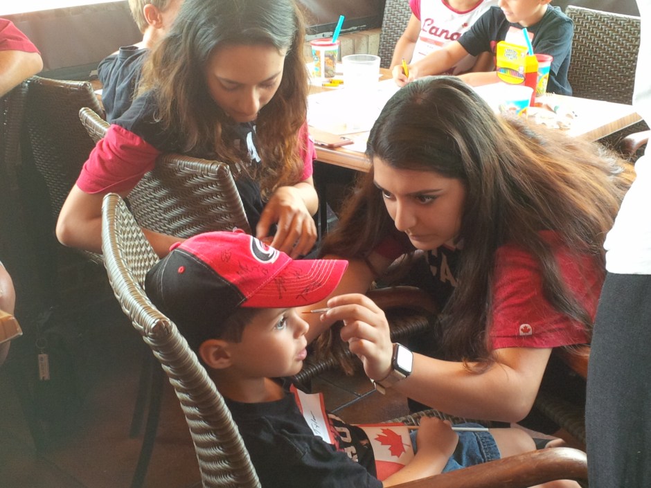 Child having his face painted